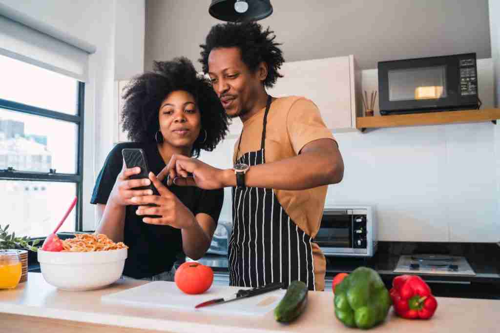 Black couple sharing things together like cooking can have a healthy sex life
