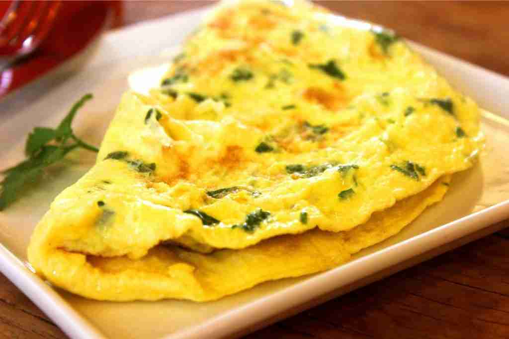 Plate of yellow fluffy omelette is another superfood