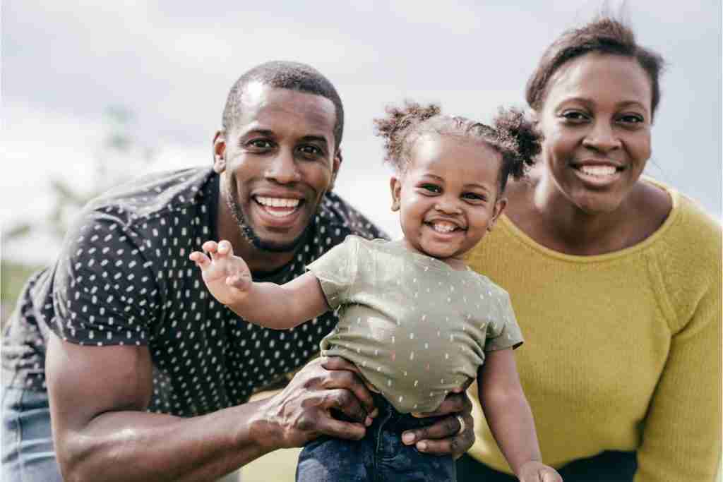 Millennial parents and and baby girl - consider family Zero Health Insurance