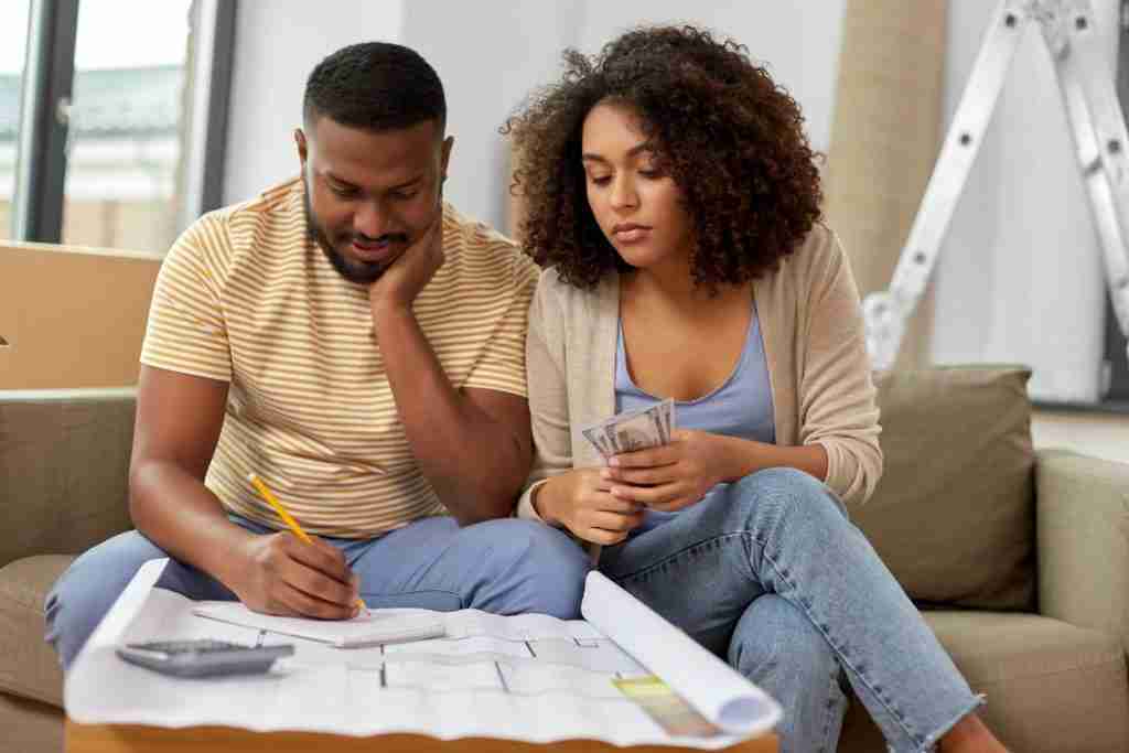 Black couple working out their budget to include healthy eating