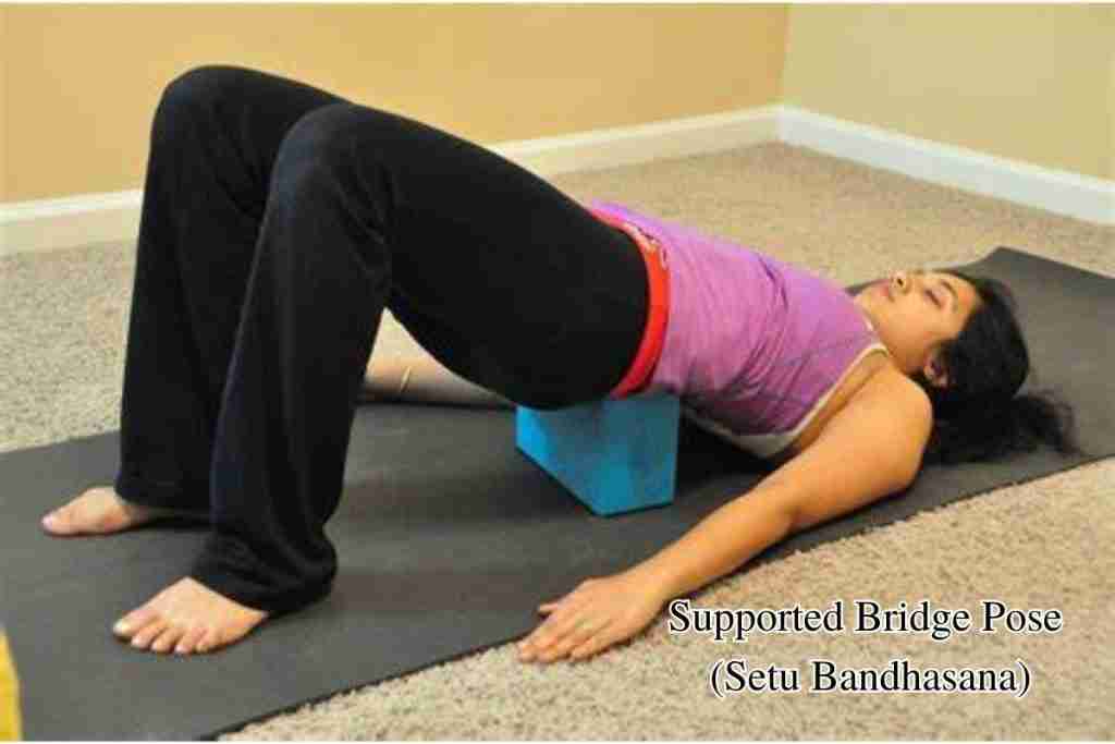 Yoga for managing fibroids - Supported Bridge Pose (Setu Bandhasana)