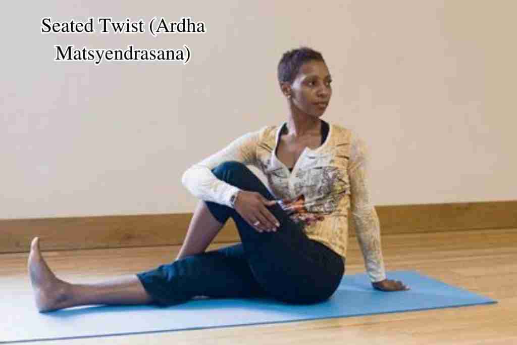 Yoga for managing fibroids - Seated Twist (Ardha Matsyendrasana)