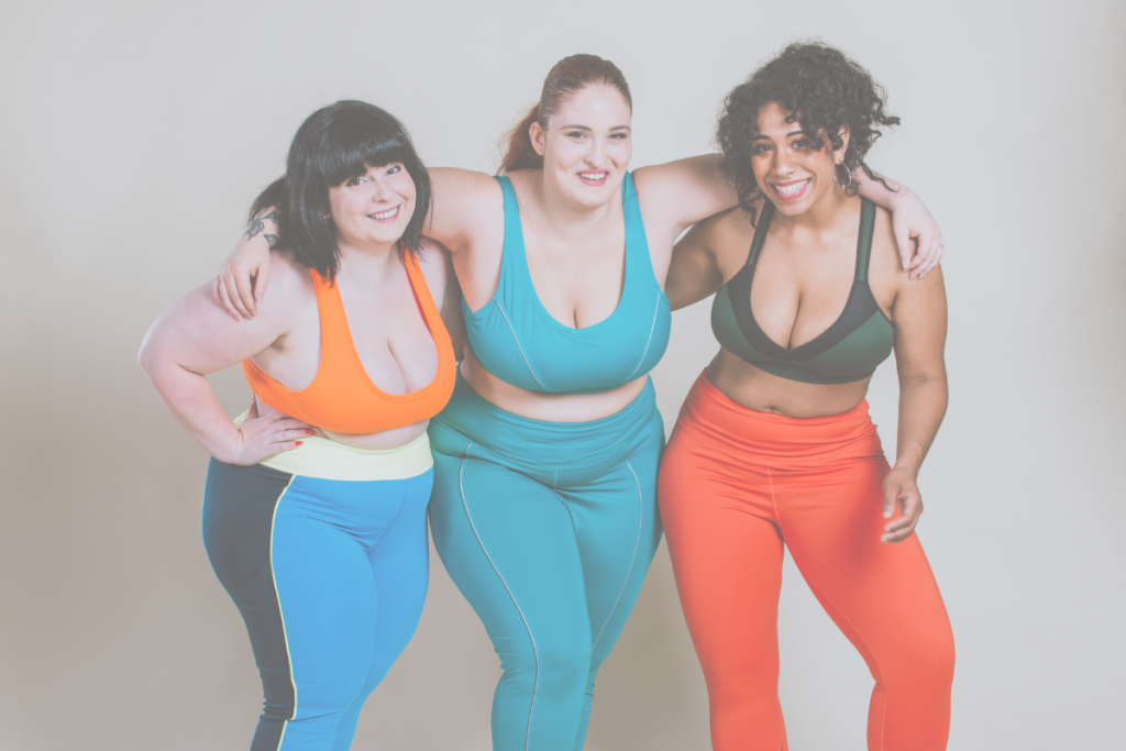 Trio of ladies in colourful workout gear - supporting each other to get the most from their workouts