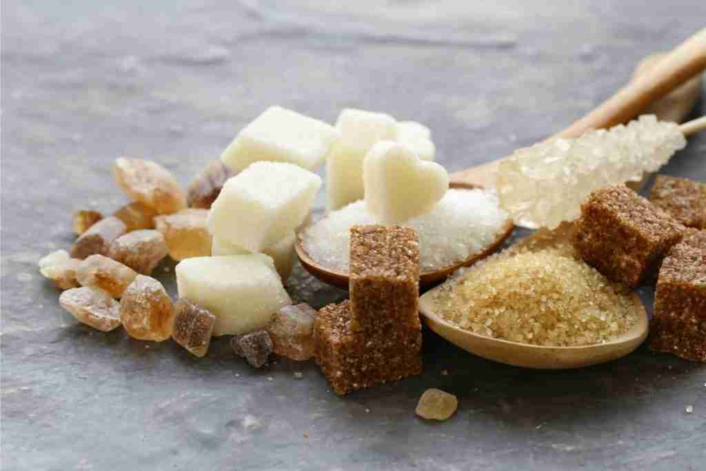 photo of brown, white sugar cubes and granules - watch out for refined carbs which can prevent effective weight loss