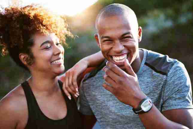 Couple sharing a laugh - communication and support are important with fibroids relationships