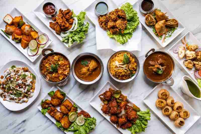 a table set with a mixture of cooked foods - lost of packaged, canned foods contain excess salt and sugar which can increase the growth of fibroids