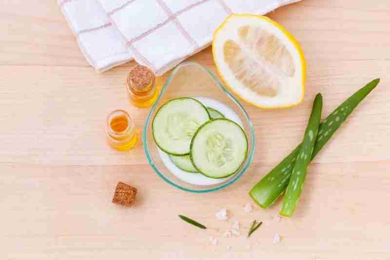 A clean image depicting sliced cucumber, lemon, aloe vera depicting some of the components to shrink fibroids naturally
