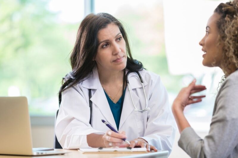 GP speaking to an upset lady - Reasons Your GP May Refuse to Prescribe Mounjaro